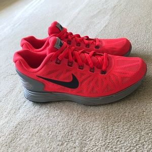 Hot pink neon Nike running shoes